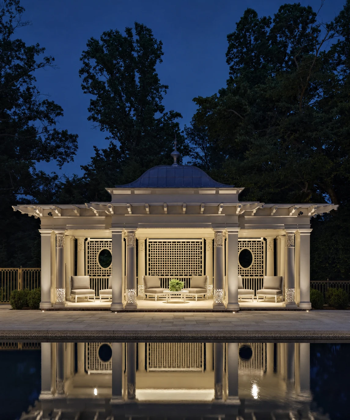 Mid Country Grandeur classical pool pavilion at night in Fairfield County, Connecticut, built by Hobbs Inc.