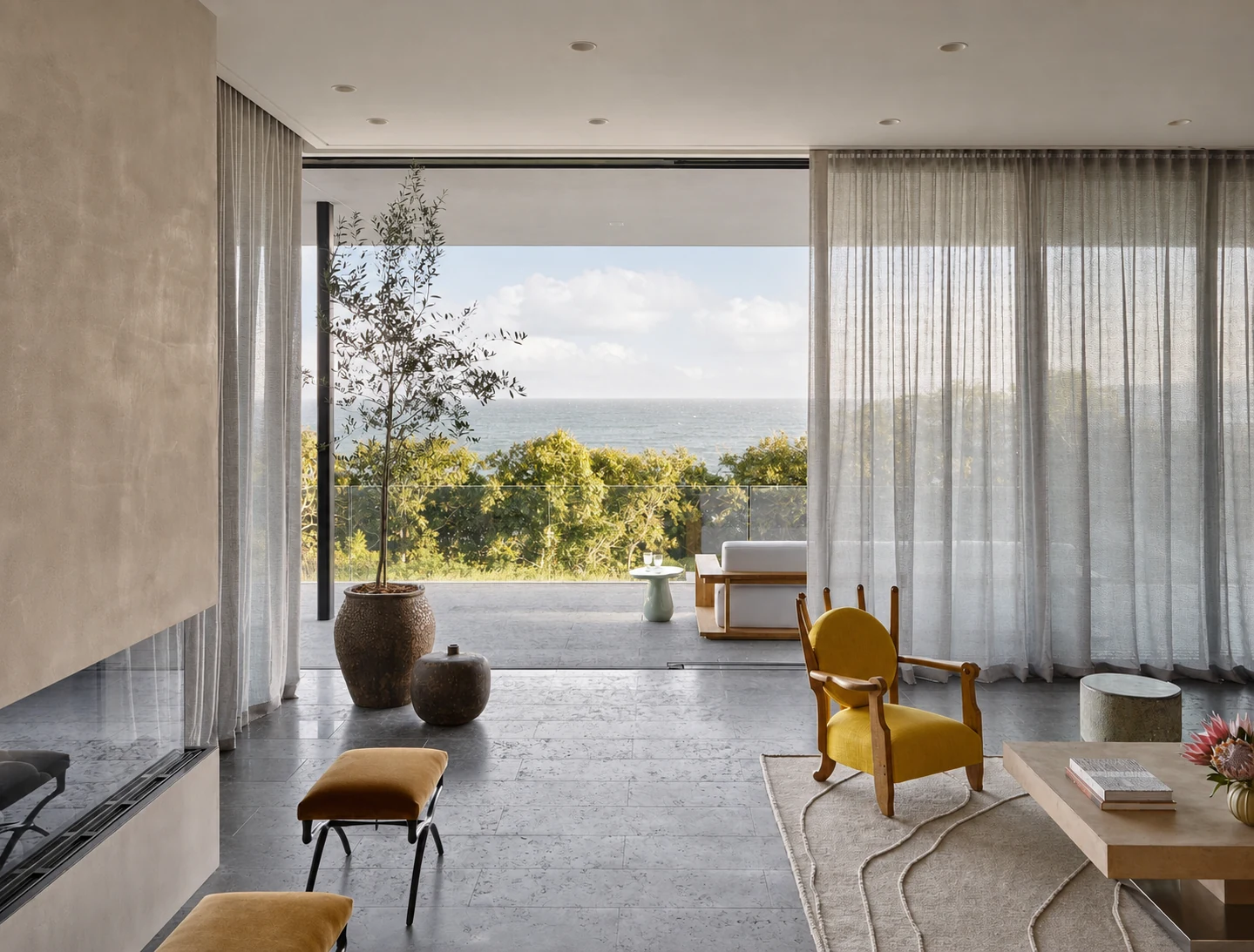 Montauk Cliff House living room opening to the ocean terrace in Montauk, New York, built by Hobbs Inc.