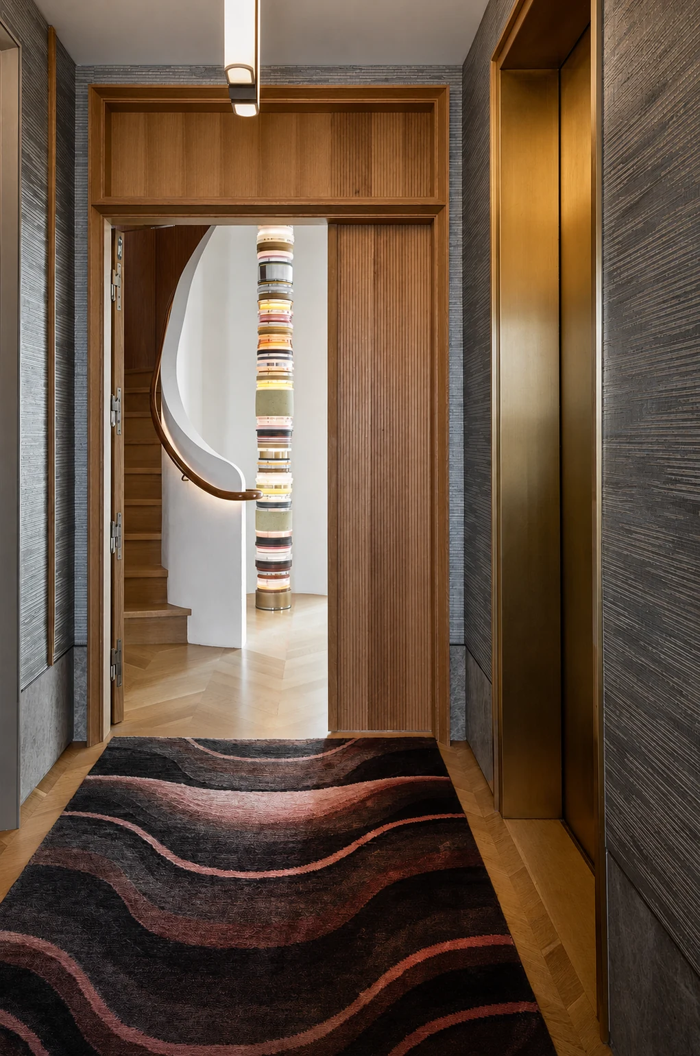 Upper East Side Penthouse Triplex elevator hall framing the sculptural stair in Upper East Side, New York City, built by Hobbs Inc.